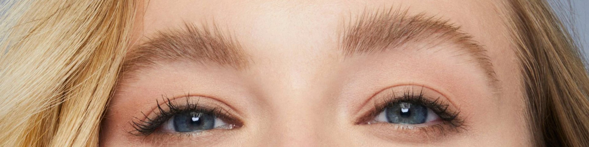 Maybelline Brow products illustrative banner image - Close up of a woman's Eyes and Eyebrows